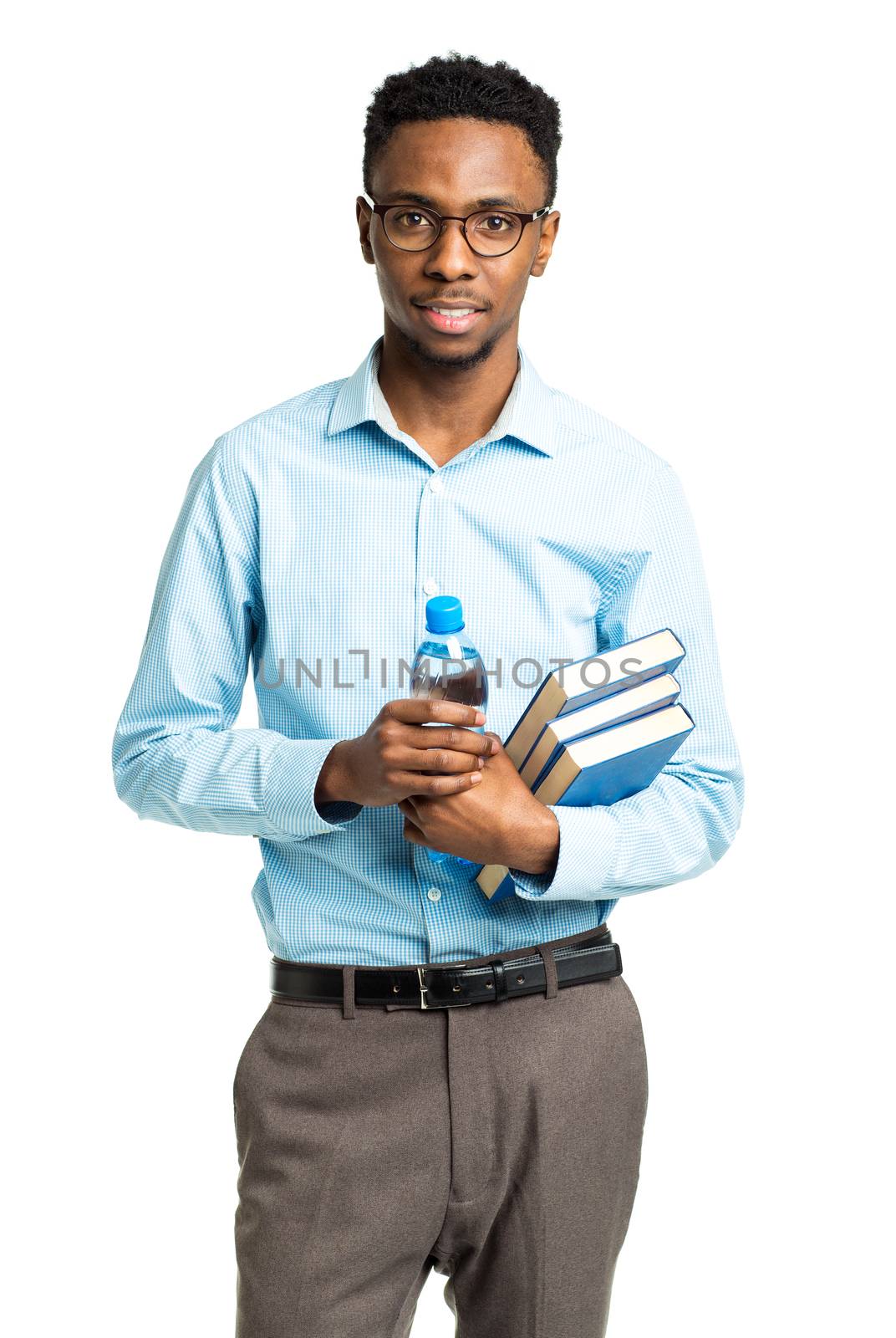 Happy african american college student with books and bottle of water in his hands standing on white background