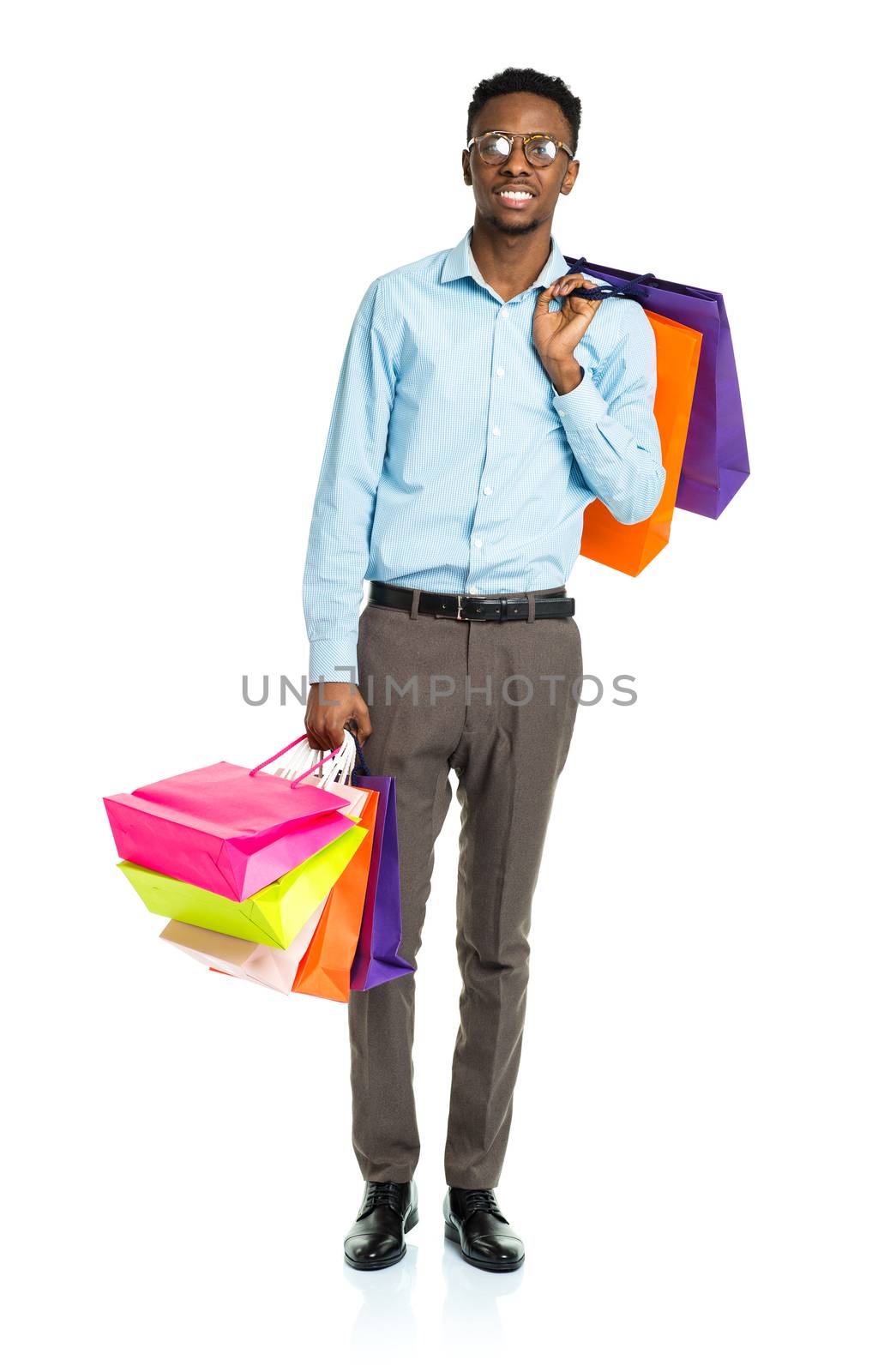 Happy african american man holding shopping bags on white backgr by vlad_star