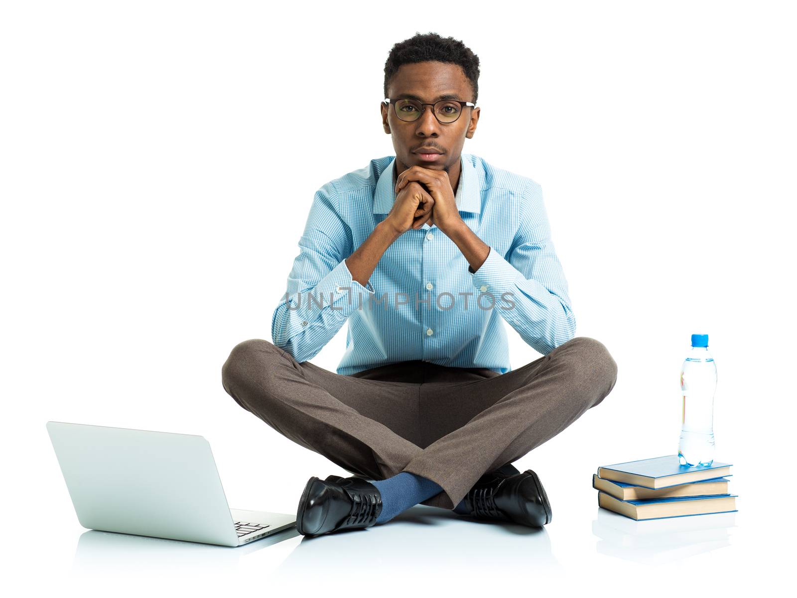 african american college student with laptop, books and bottle o by vlad_star