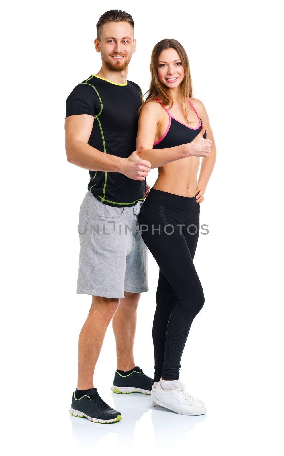 Athletic man and woman after fitness exercise with a thumb up on the white background