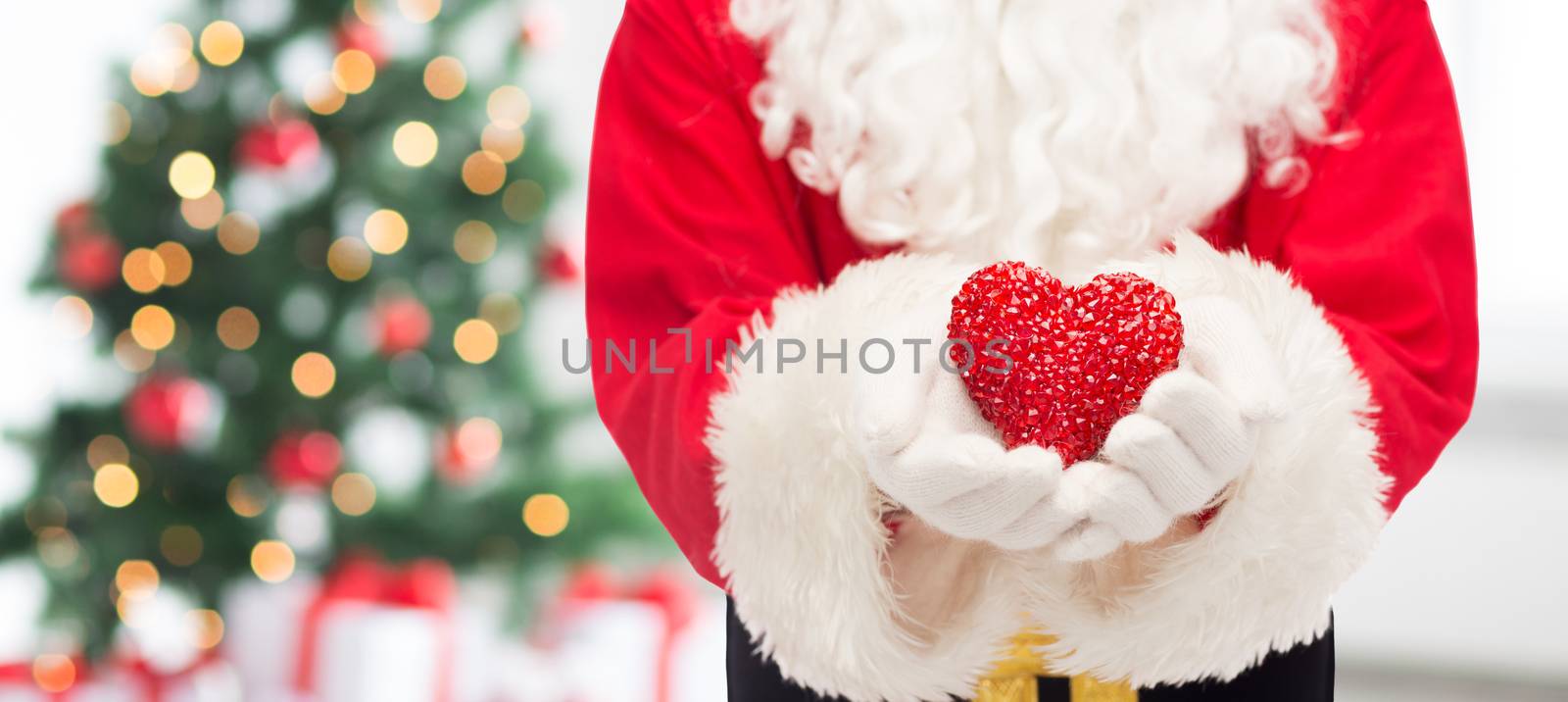 close up of santa claus with heart shape by dolgachov