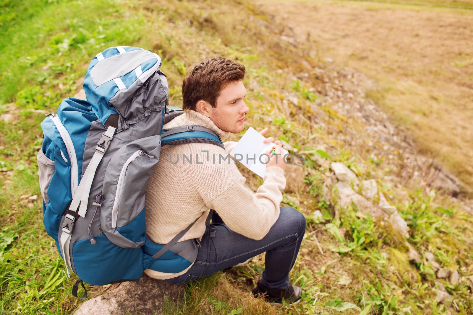 man with backpack hiking by dolgachov