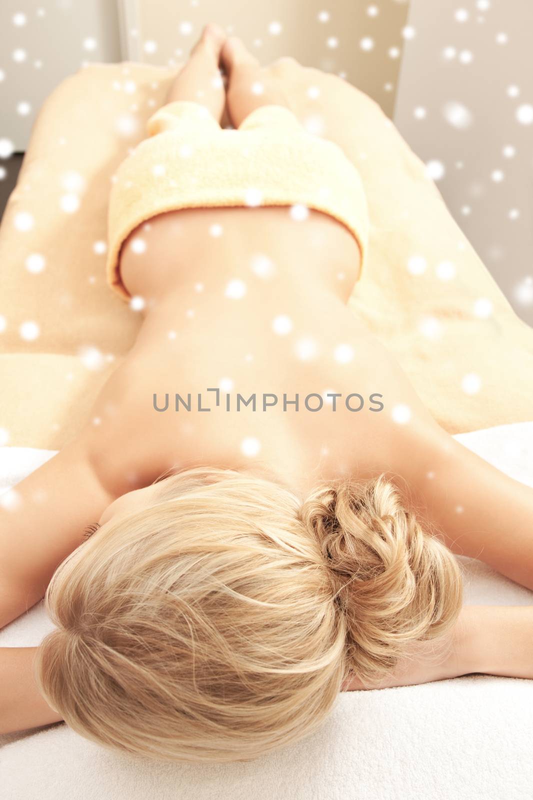 beauty, health, people and spa concept - beautiful young woman in spa