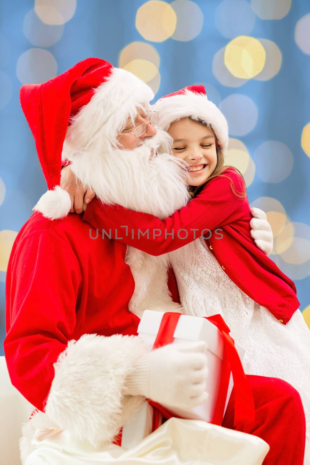 smiling little girl with santa claus by dolgachov