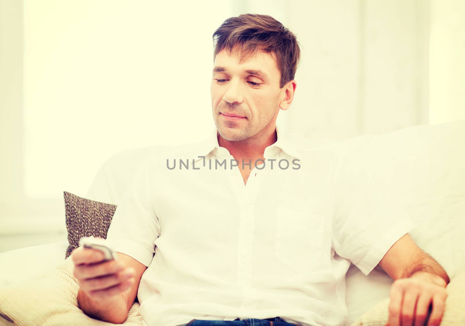 business, communication, modern technology concept - buisnessman with smartphone