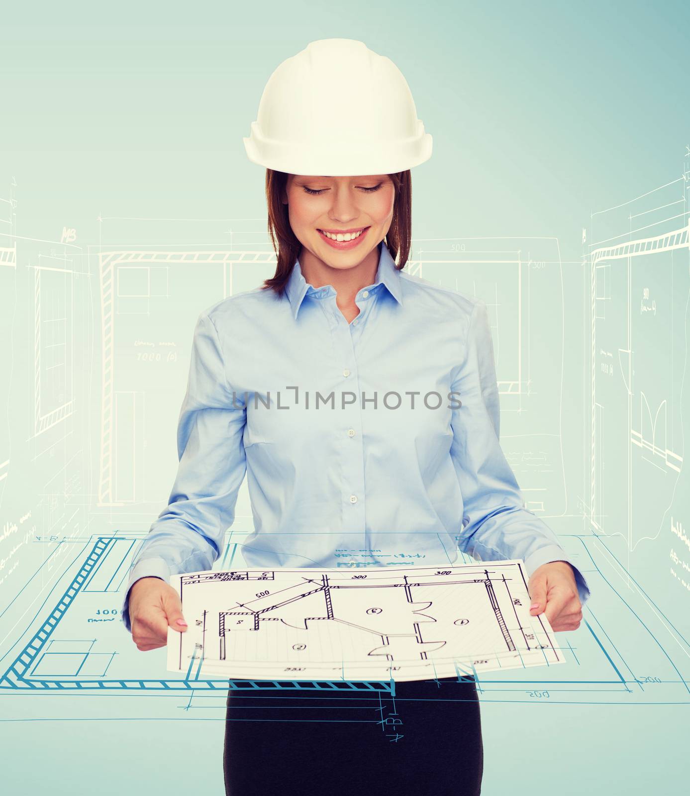 businesswoman in helmet looking at blueprint by dolgachov