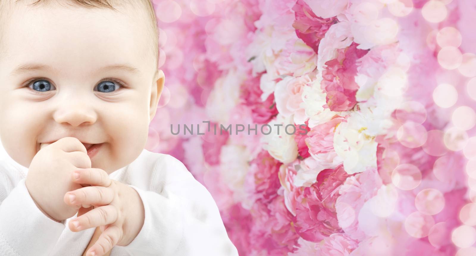 child, happiness and people concept - adorable baby