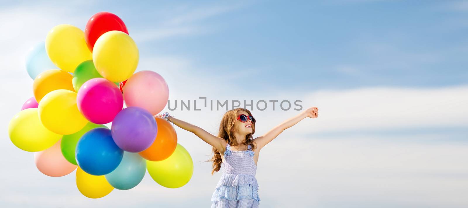 happy girl with colorful balloons by dolgachov