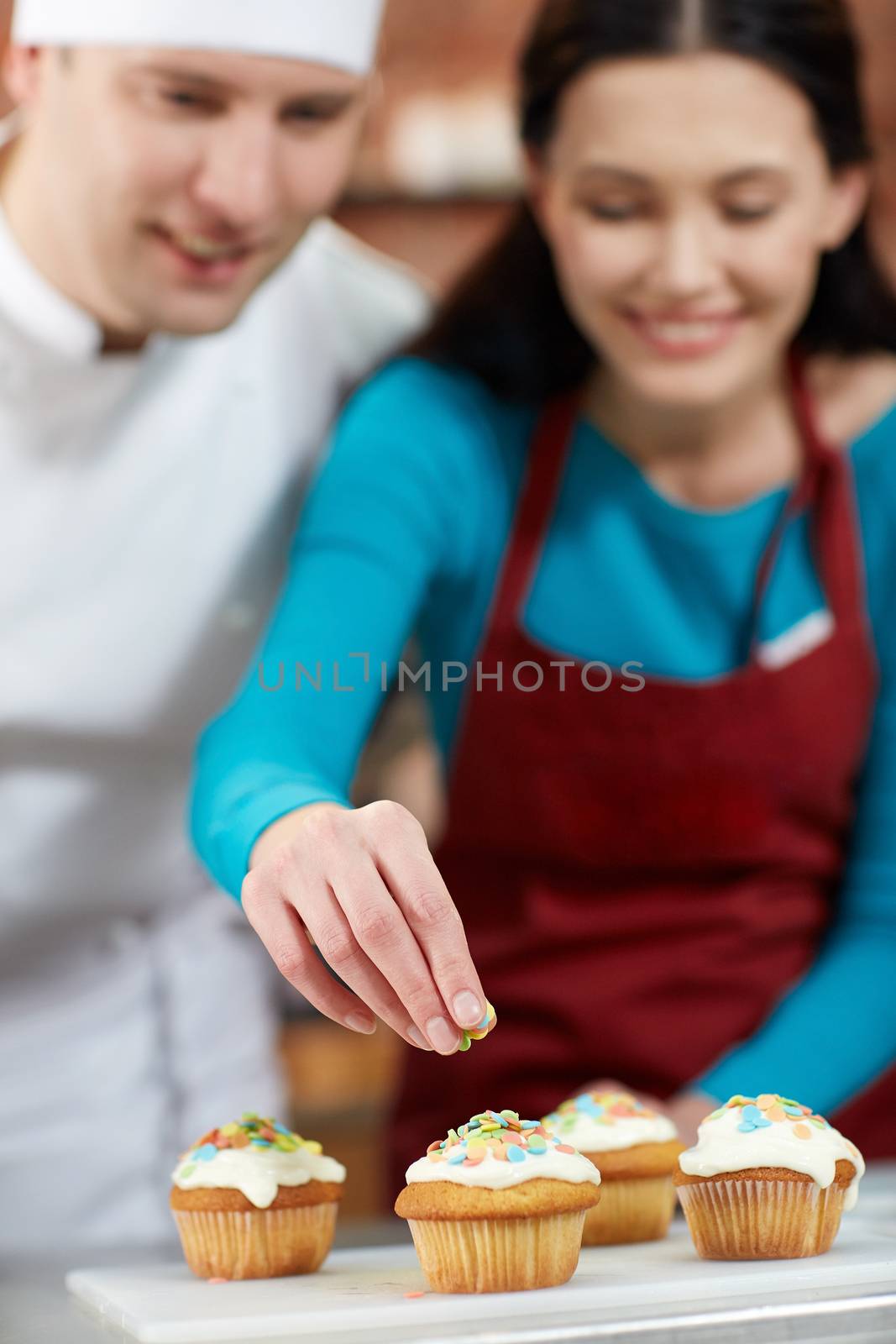 happy woman and chef cook baking in kitchen by dolgachov
