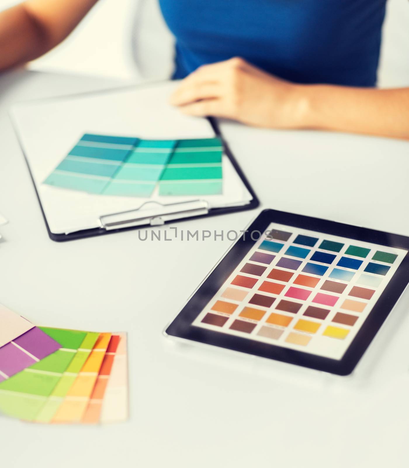 woman working with color samples for selection by dolgachov