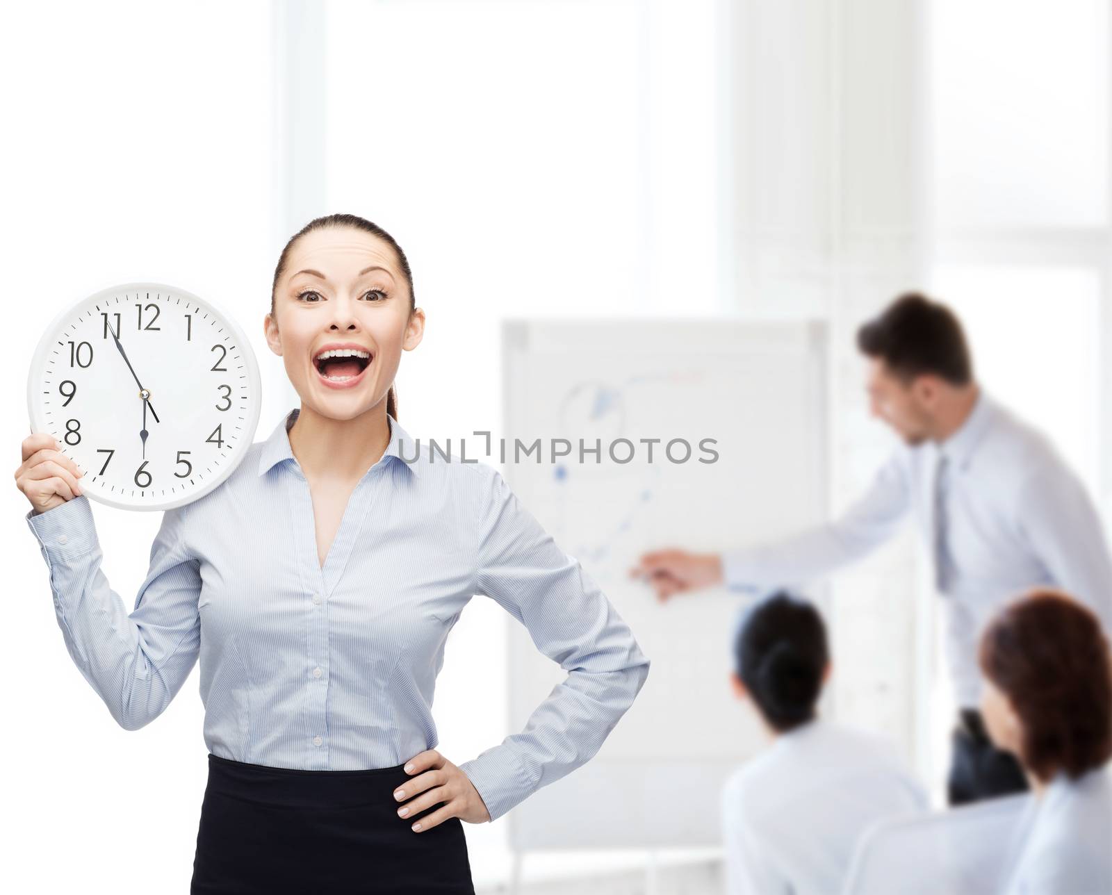 attractive businesswoman with wall clock by dolgachov