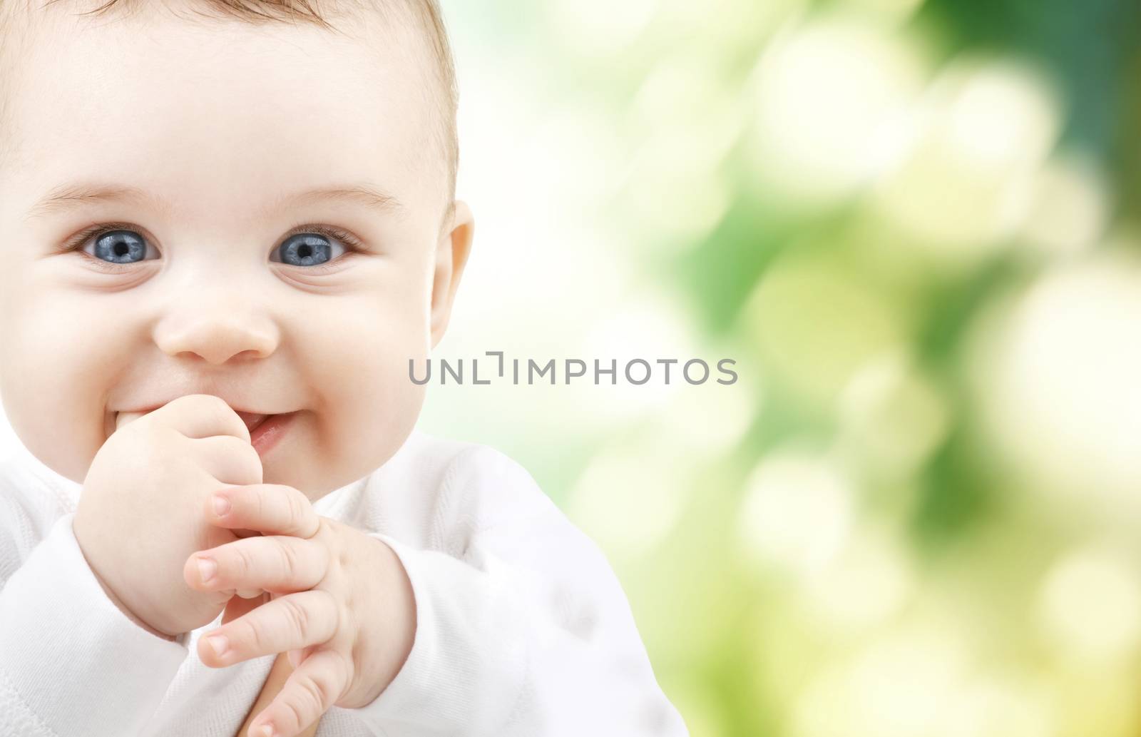 child, happiness and people concept - adorable baby