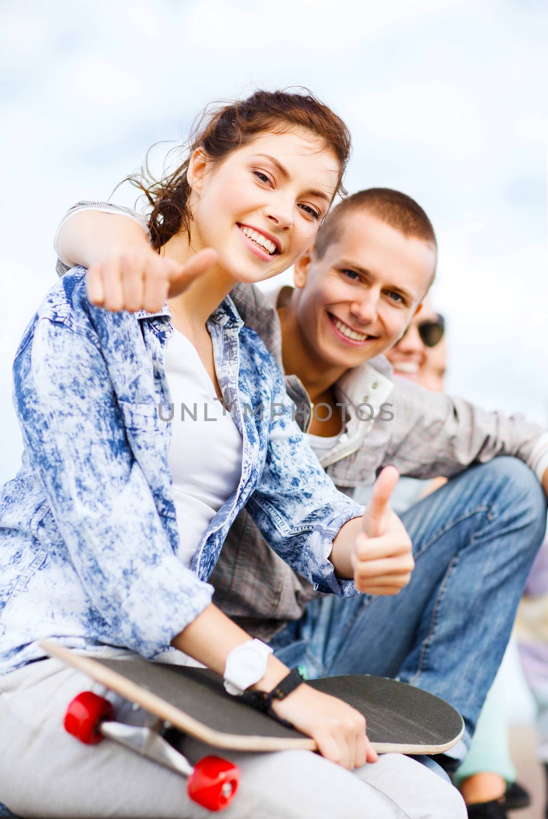 teenages with skateboard outside by dolgachov