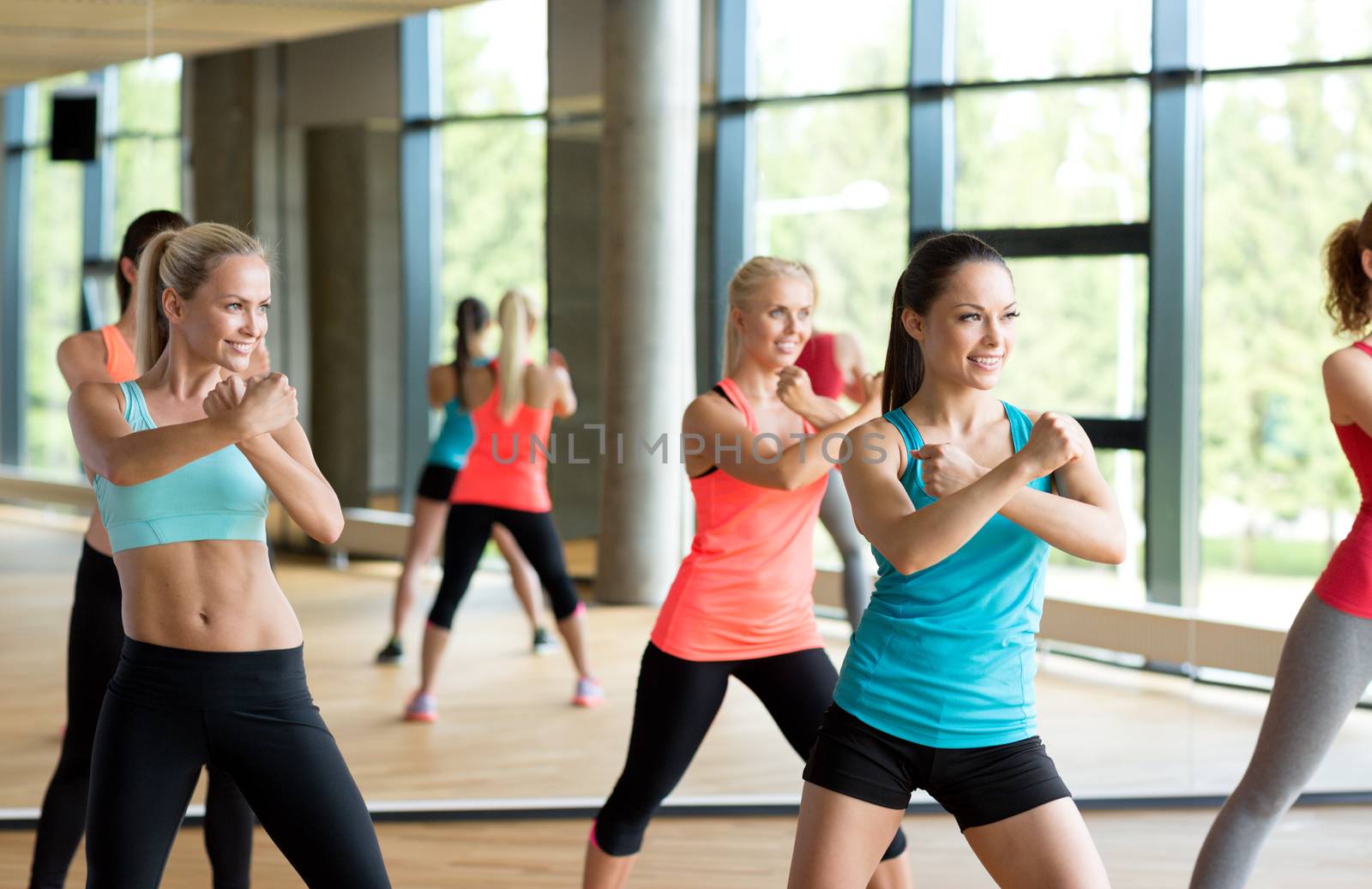 group of women working out in gym by dolgachov