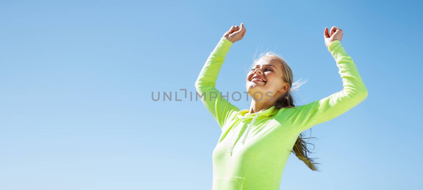 woman runner celebrating victory by dolgachov