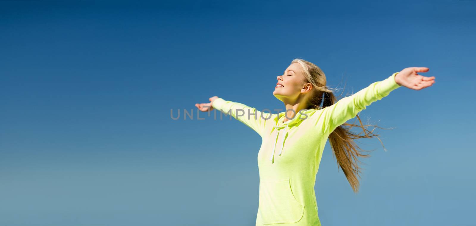woman doing sports outdoors by dolgachov