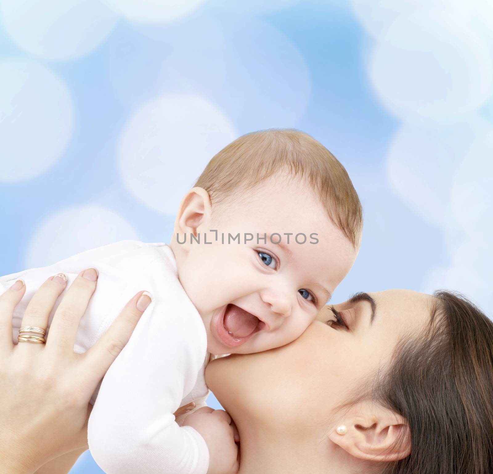 laughing baby playing with mother by dolgachov
