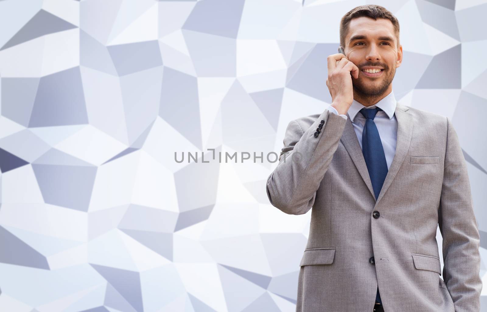 smiling businessman with smartphone outdoors by dolgachov