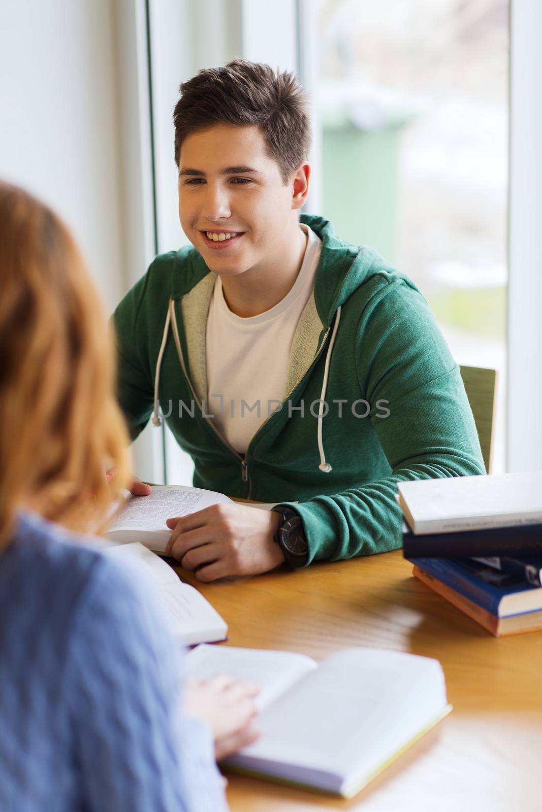 students with books preparing to exam in library by dolgachov