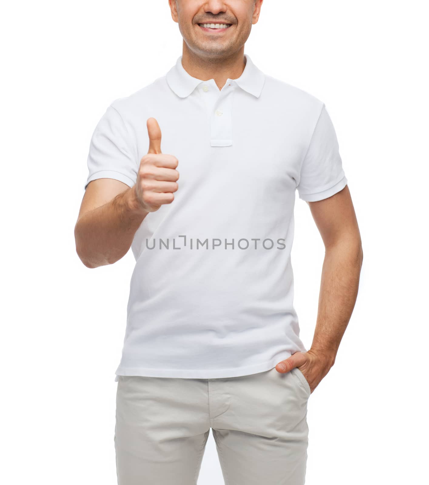 happiness, gesture and people concept - smiling man showing thumbs up