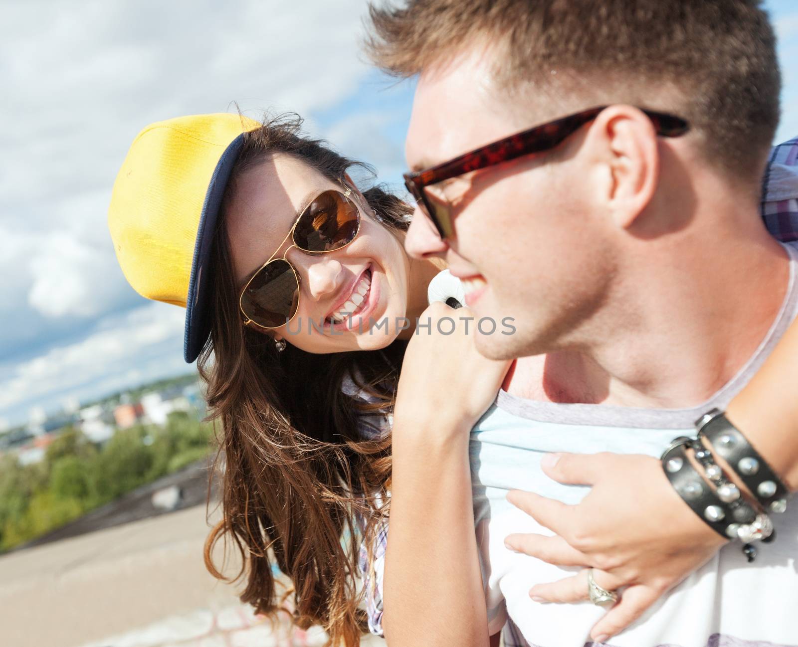 summer holidays and teenage concept - teenagers having fun outside