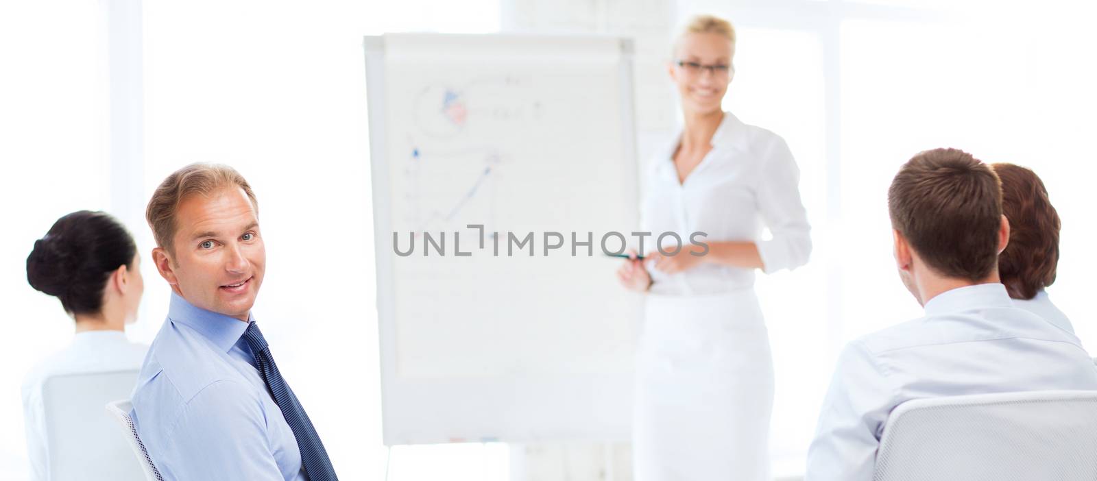 picture of smiling businessman on business meeting in office