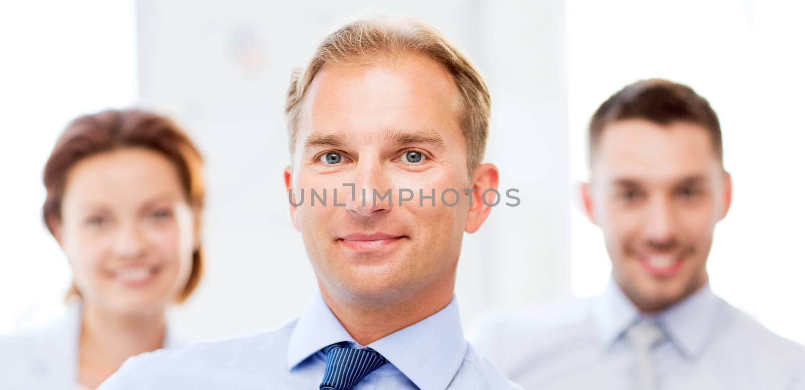 picture of smiling handsome businessman in office