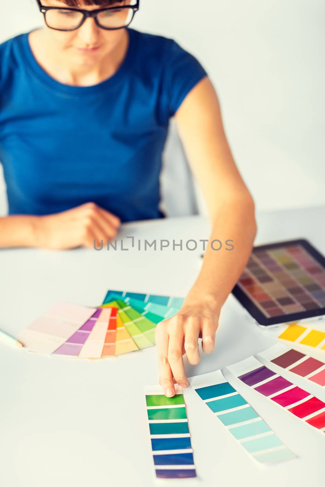 interior design, renovation and technology concept - woman working with color samples for selection