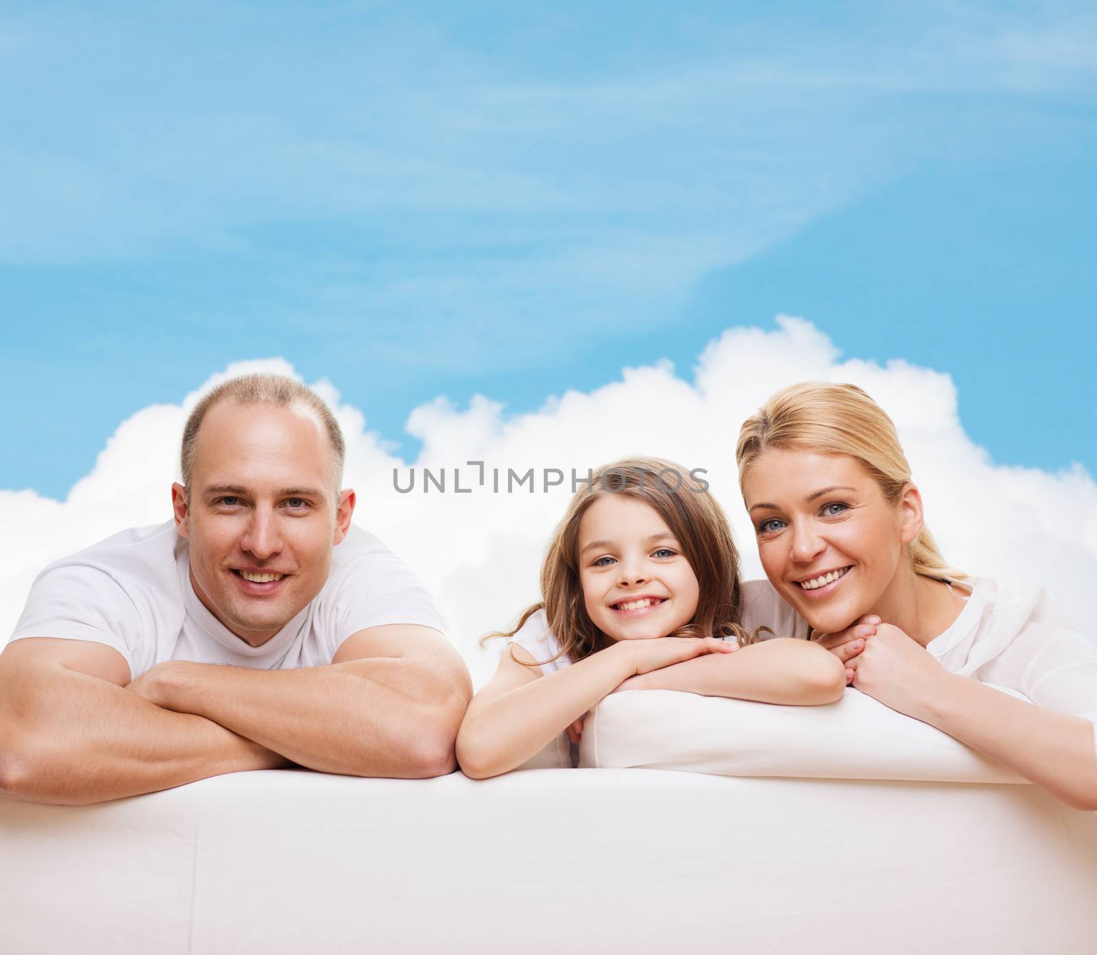 family, childhood and people - smiling mother, father and little girl over blue sky and white cloud background