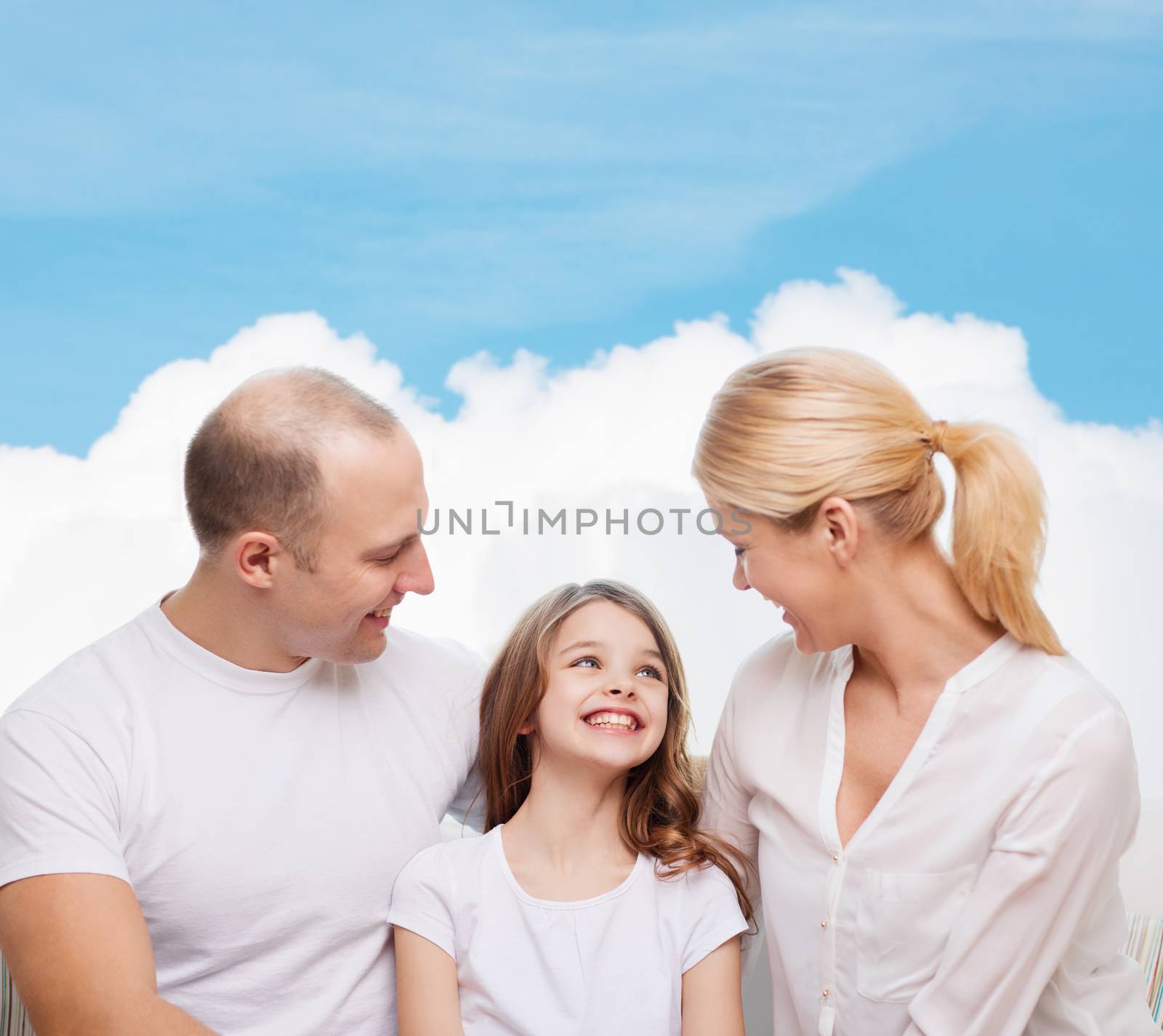 family, childhood and people - smiling mother, father and little girl over blue sky and white cloud background