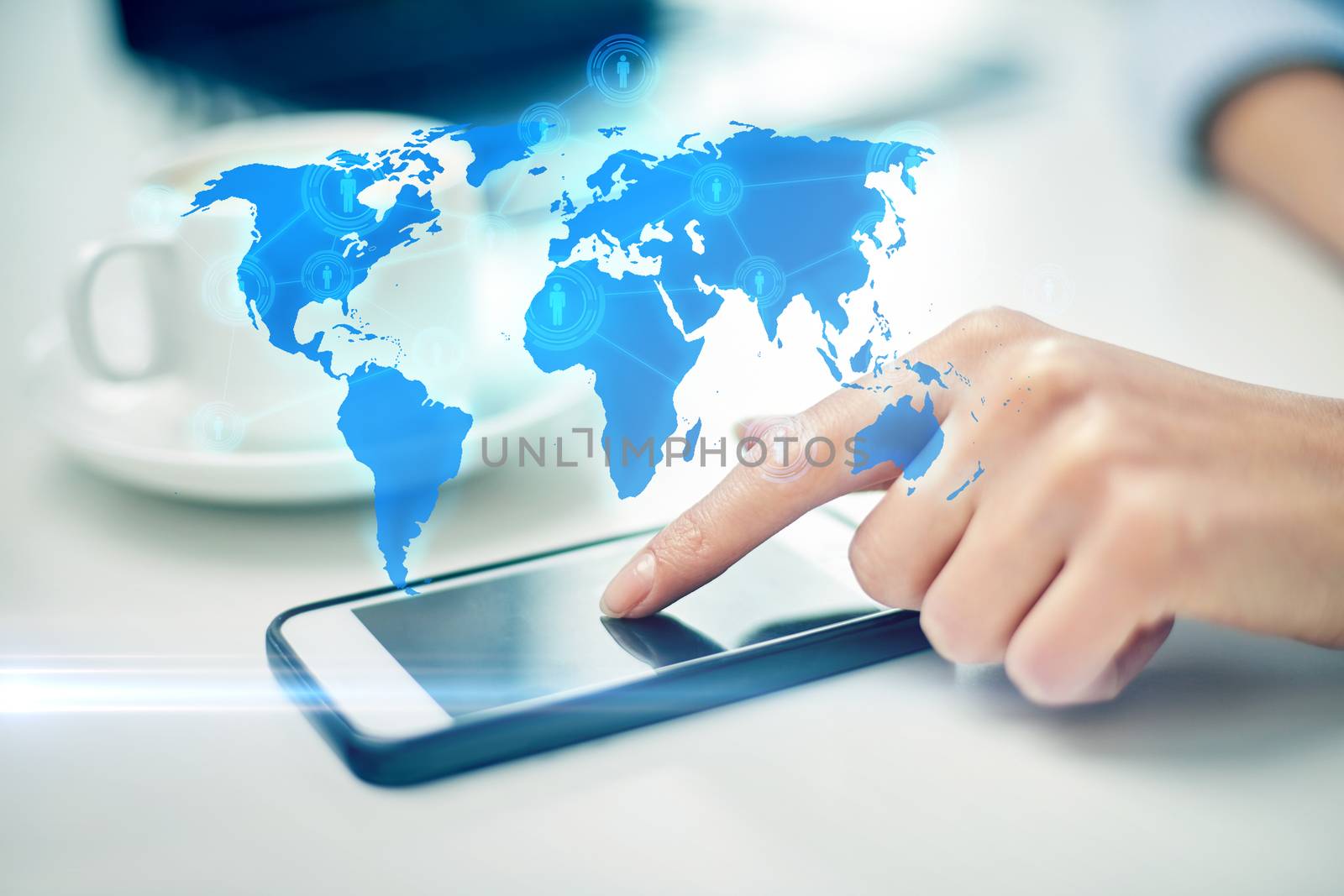 business, technology, global communication and people concept - close up of woman hand with smartphone and coffee pointing finger to screen over world map projection