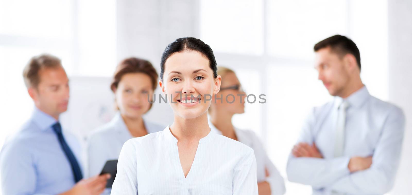 picture of smiling attractive businesswoman in office