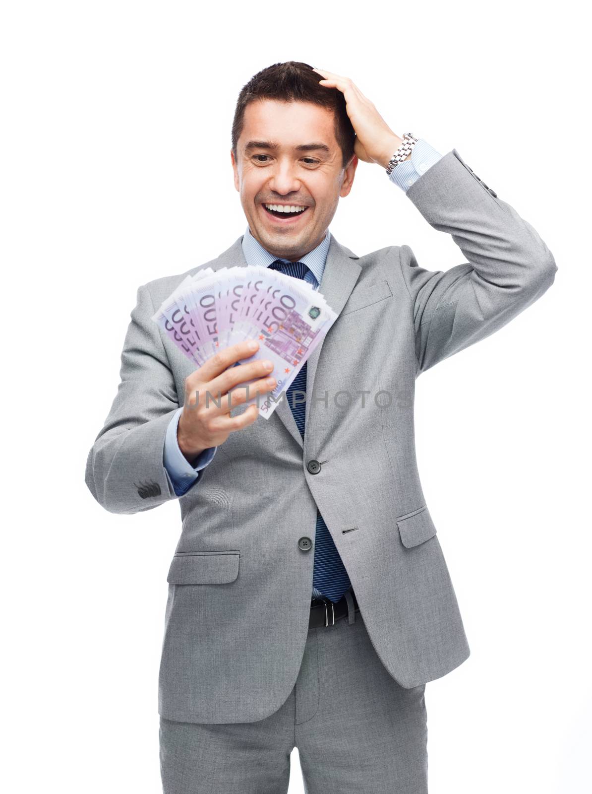 business, people and finances concept - happy laughing businessman with euro money