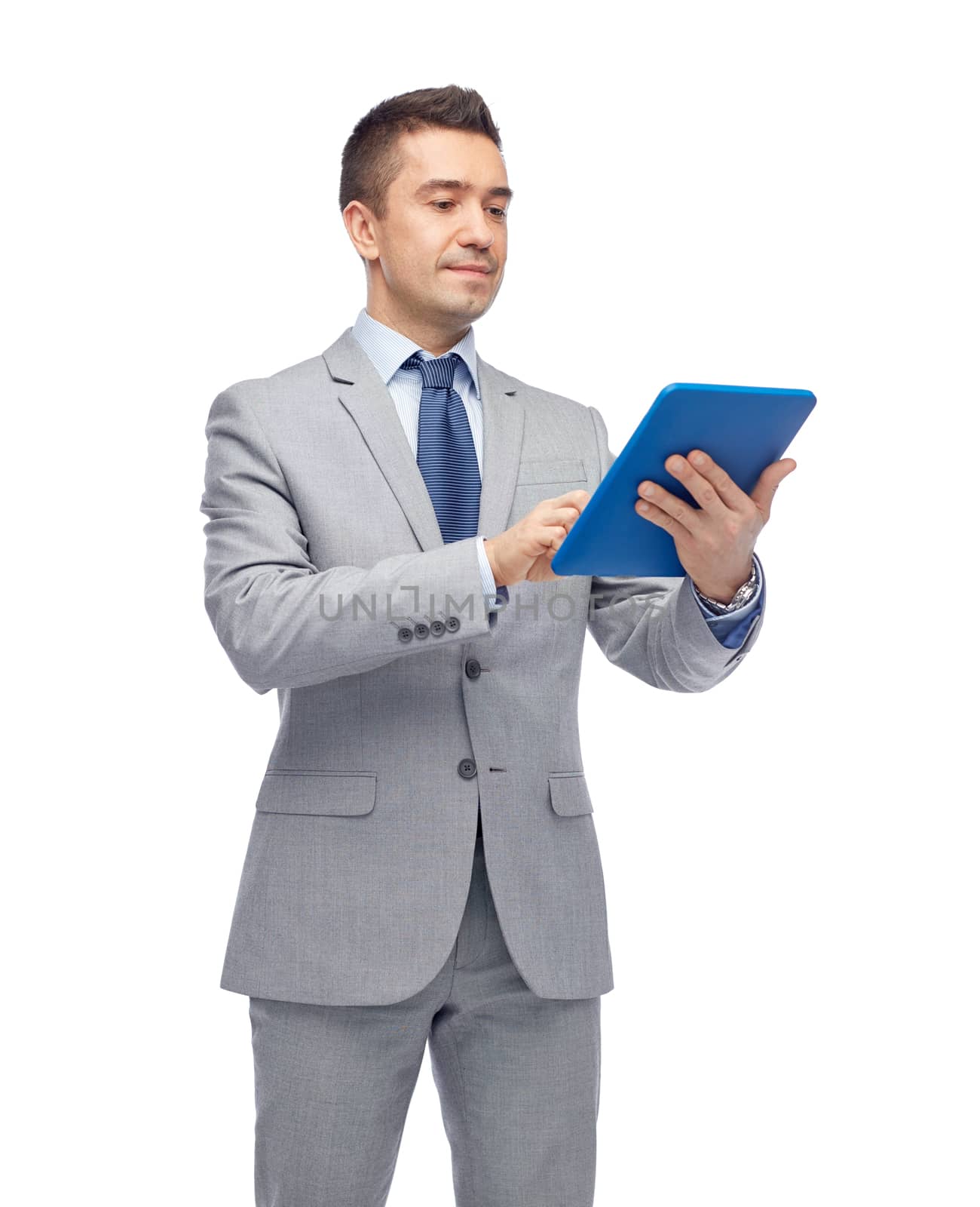 business, people and technology concept - happy businessman in suit holding tablet pc computer