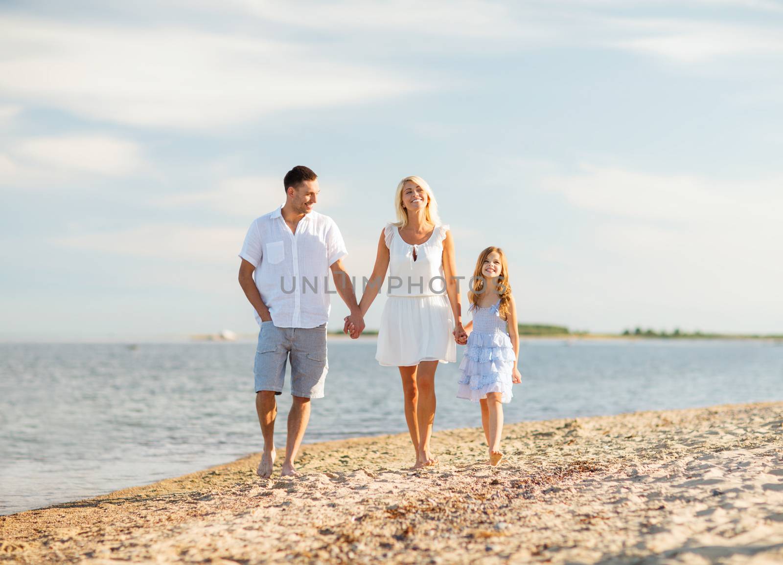 summer holidays, children and people concept - happy family at the seaside