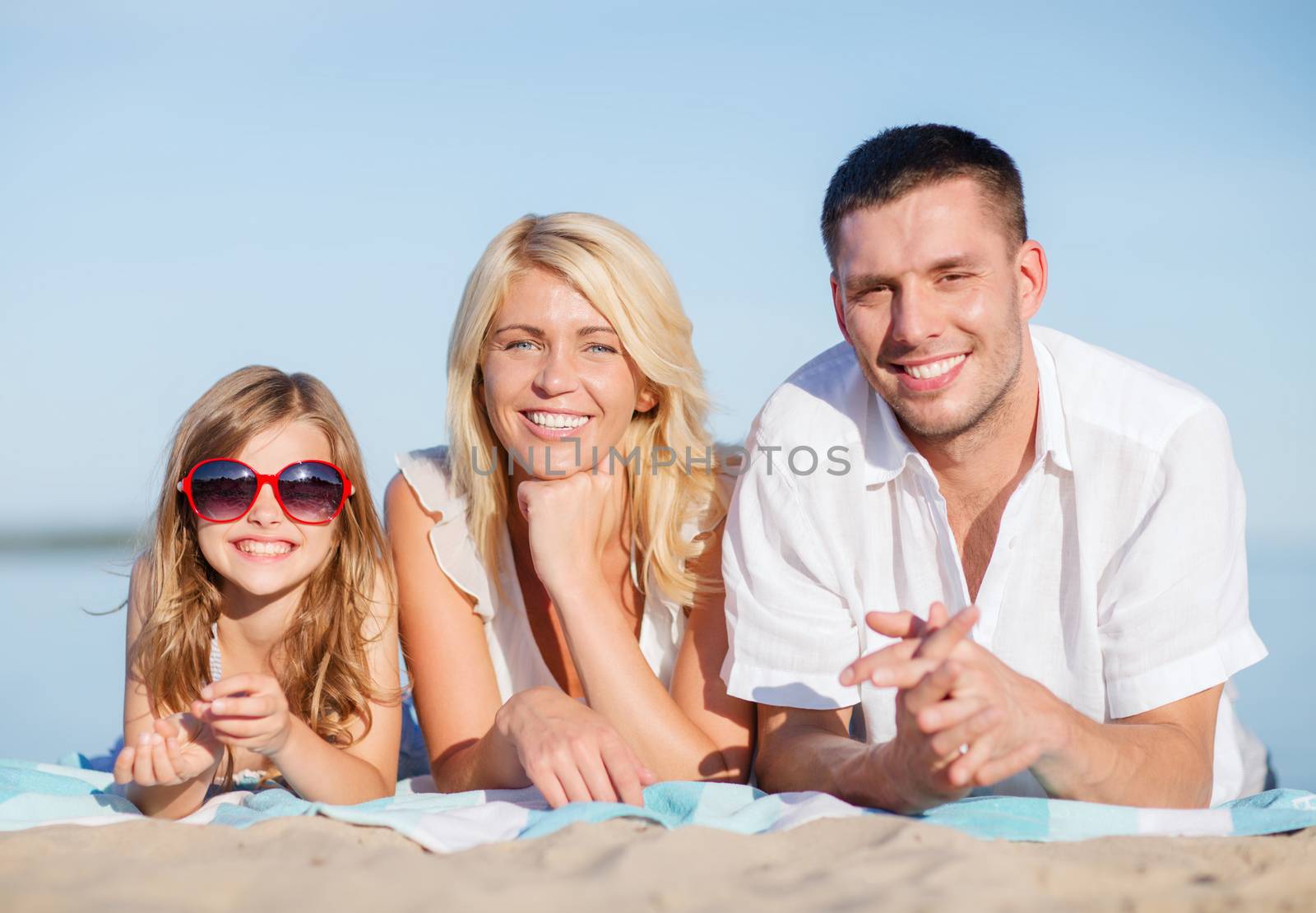 happy family on the beach by dolgachov