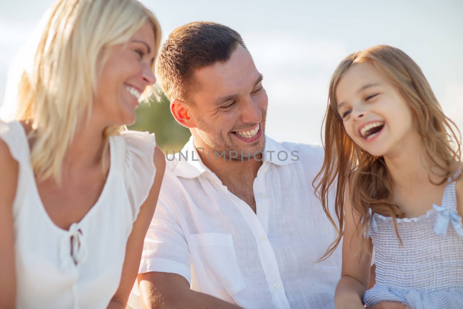 happy family having a picnic by dolgachov