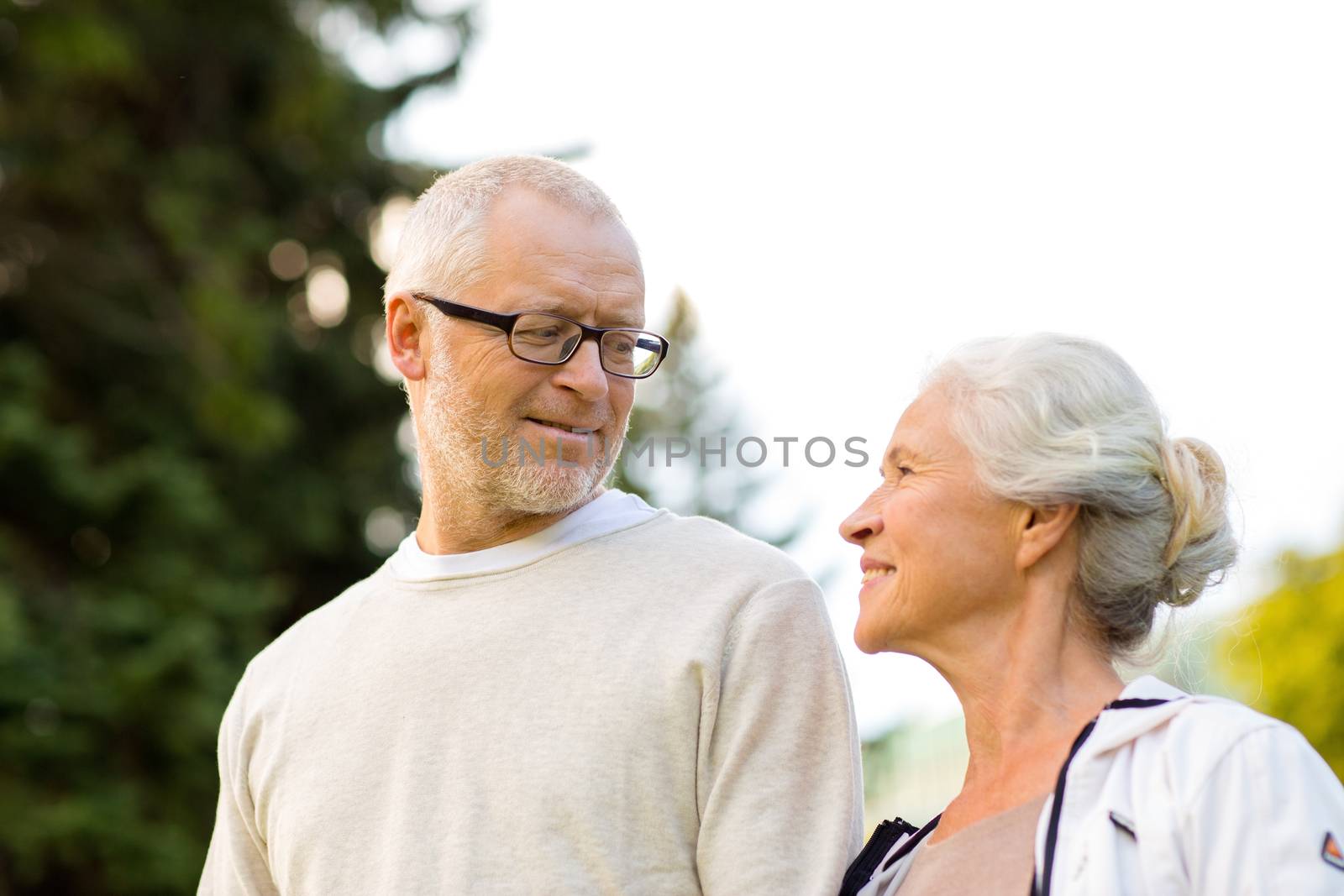 family, age, tourism, travel and people concept - senior couple in city park