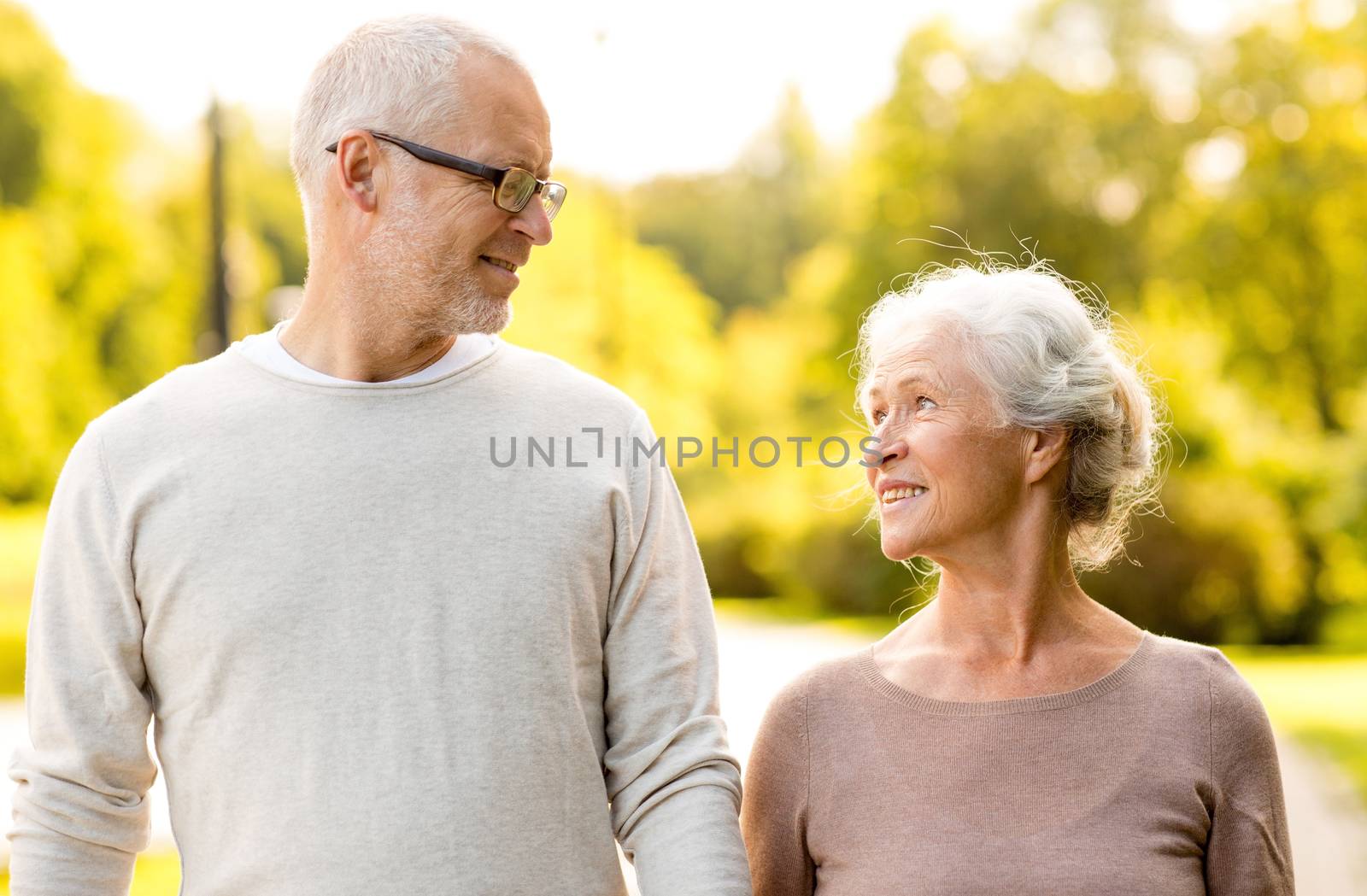 family, age, tourism, travel and people concept - senior couple in city park