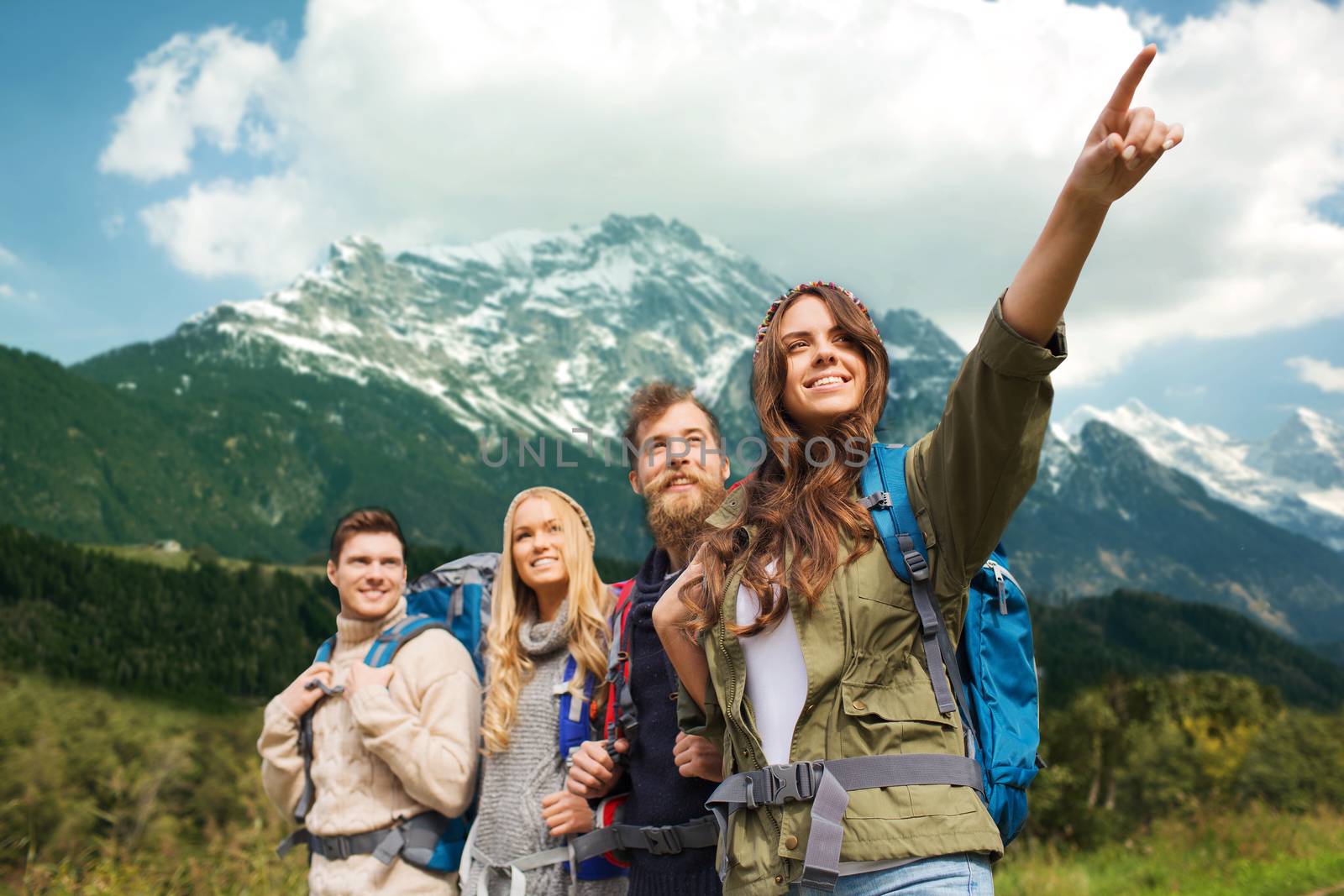 group of smiling friends with backpacks hiking by dolgachov