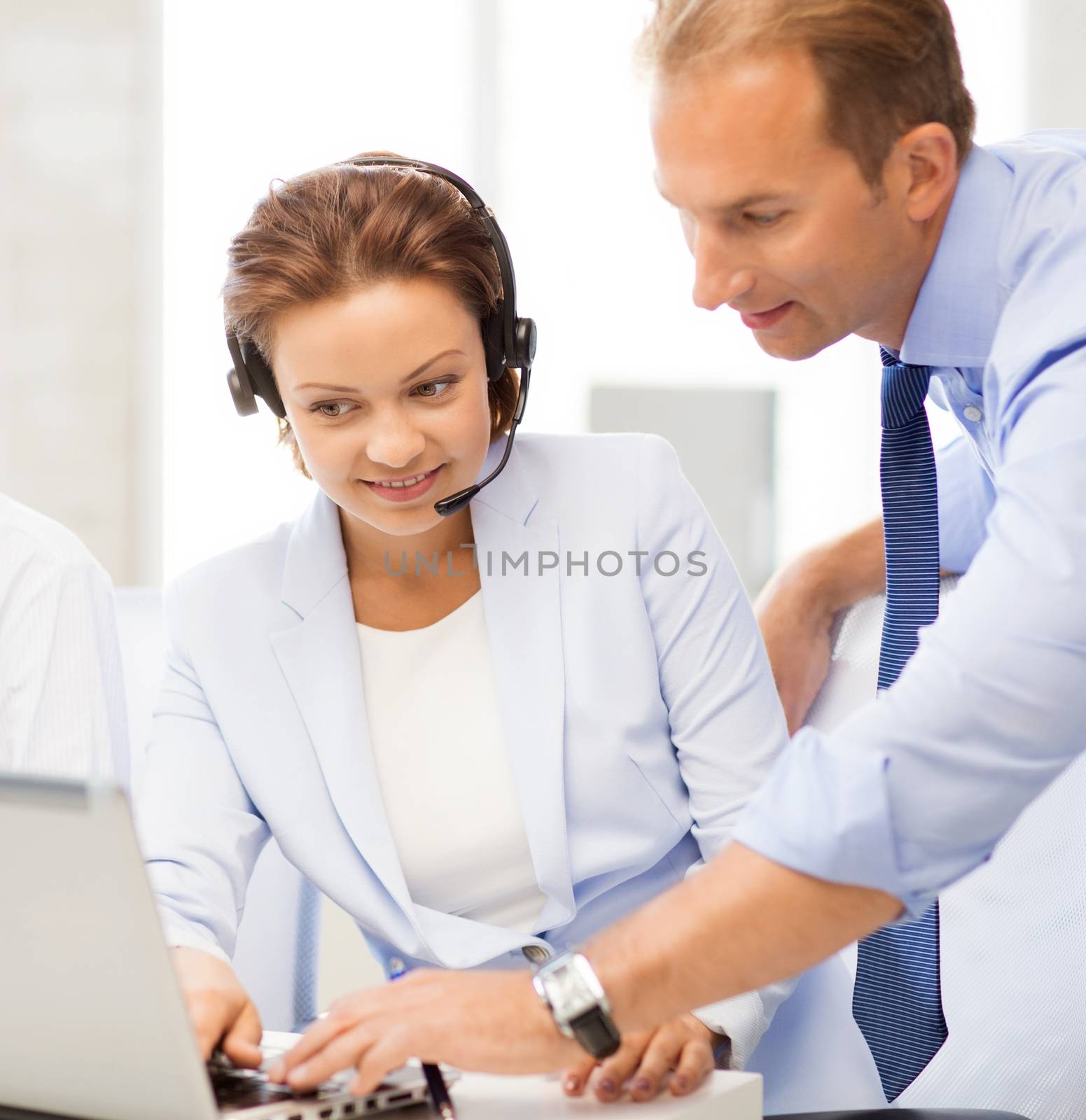 group of people working in call center by dolgachov