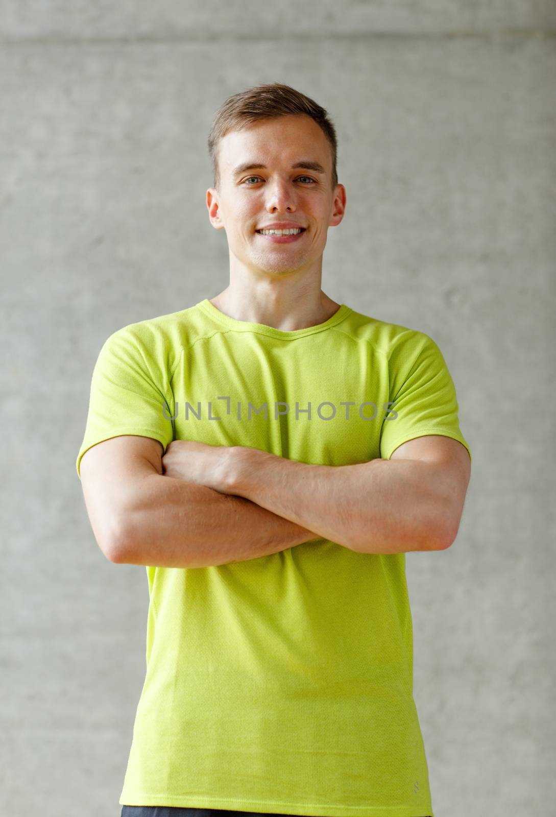 smiling man in gym by dolgachov