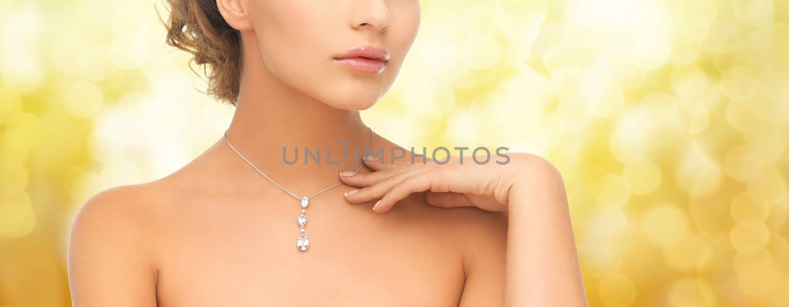 woman wearing shiny diamond pendant by dolgachov