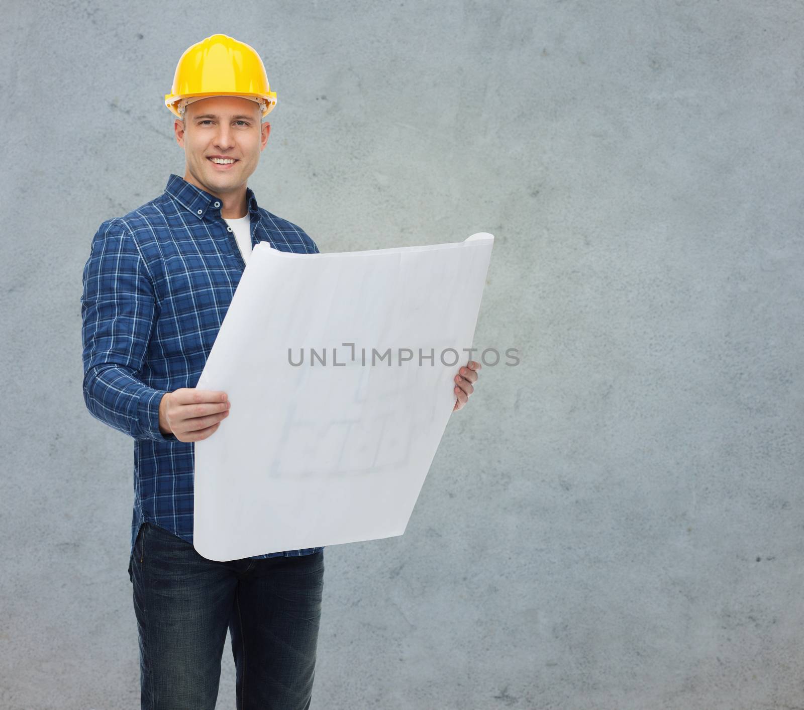 repair, construction, building, people and maintenance concept - smiling male builder or manual worker in helmet with blueprint over gray concrete wall background