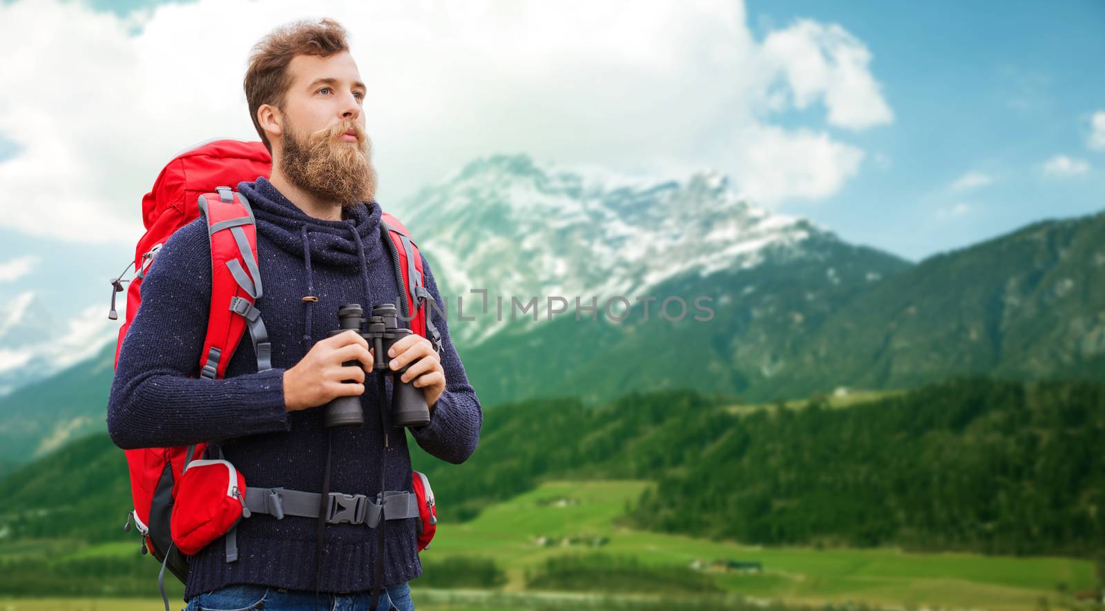 man with backpack and binocular outdoors by dolgachov