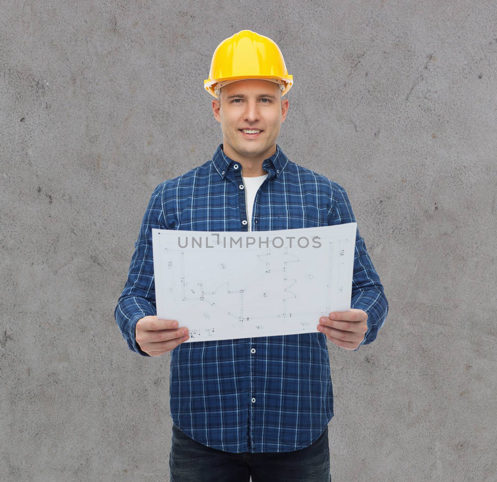 repair, construction, building, people and maintenance concept - smiling male builder or manual worker in helmet with blueprint over gray concrete wall background