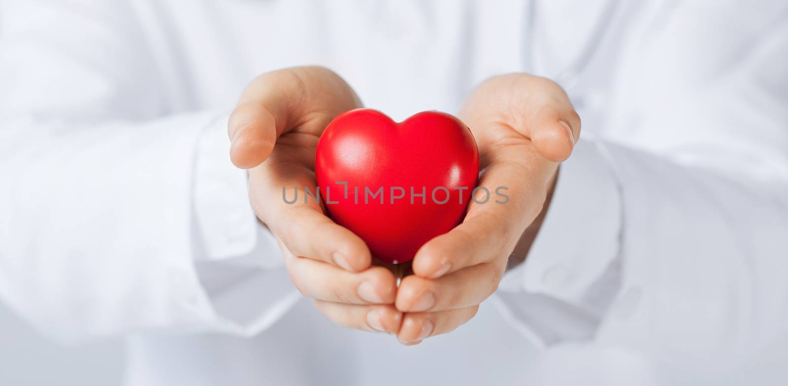 close up of man hands with heart