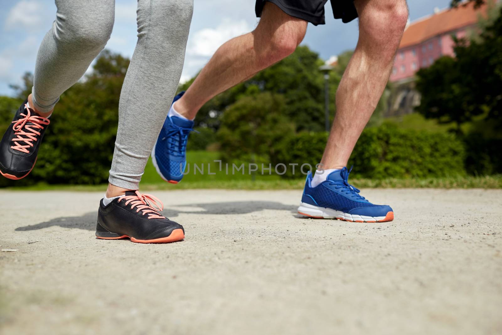 close up of couple running outdoors by dolgachov
