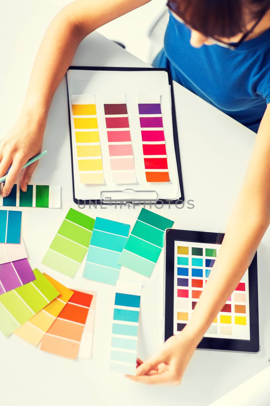 woman working with color samples for selection by dolgachov