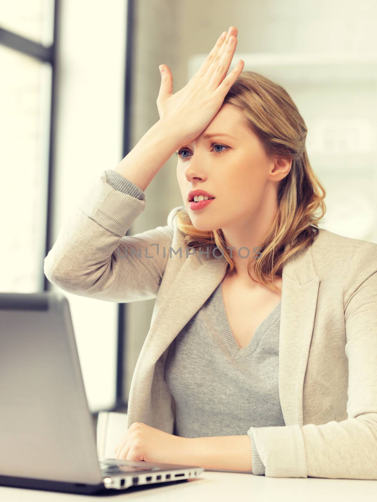 picture of stressed woman with laptop computer